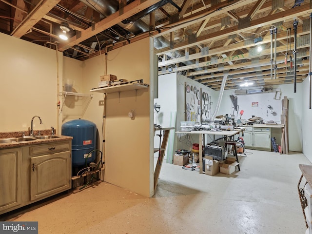 basement featuring a workshop area and sink