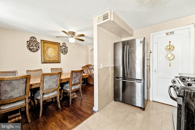 dining area featuring light hardwood / wood-style flooring and ceiling fan