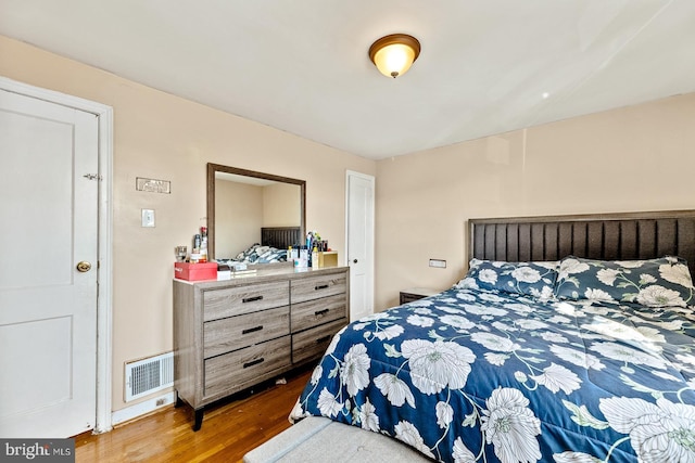 bedroom featuring wood-type flooring