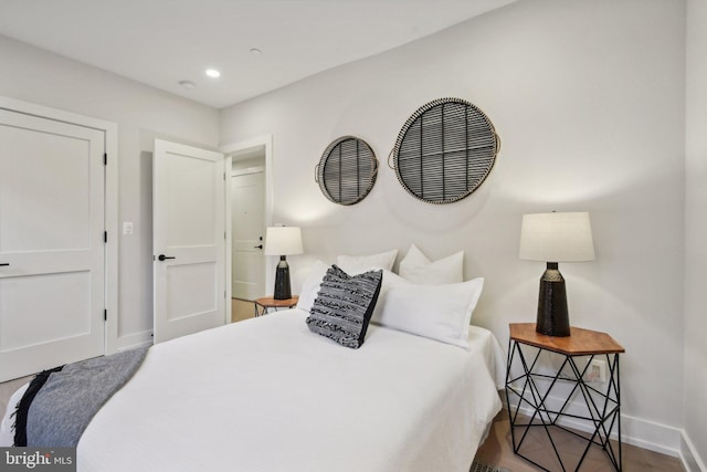 bedroom featuring hardwood / wood-style floors