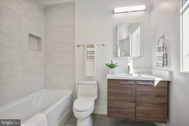 bathroom with tile patterned flooring, vanity, and toilet