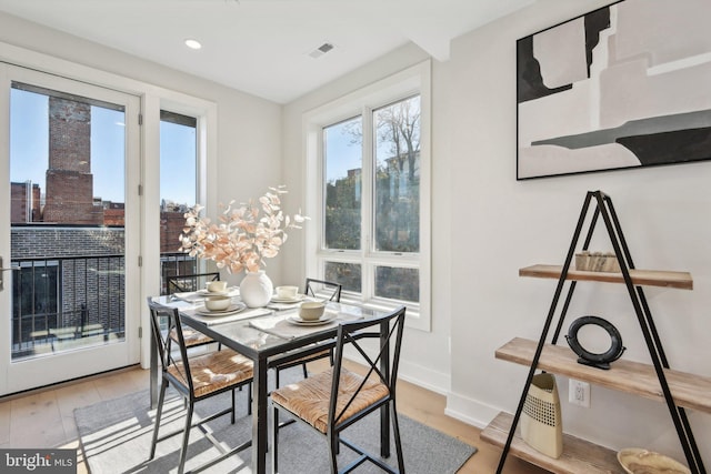 dining area featuring light wood-type flooring