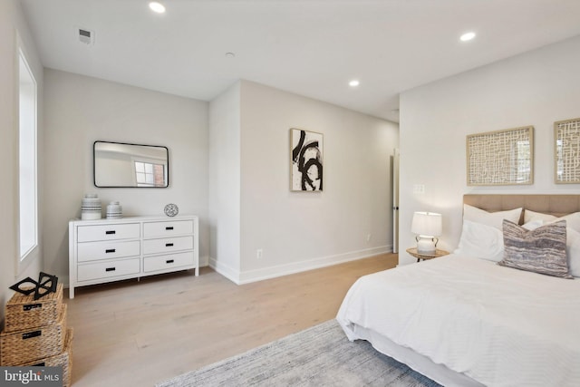 bedroom with light hardwood / wood-style flooring