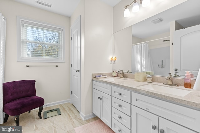 bathroom with vanity and walk in shower