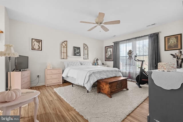 bedroom featuring light hardwood / wood-style flooring and ceiling fan