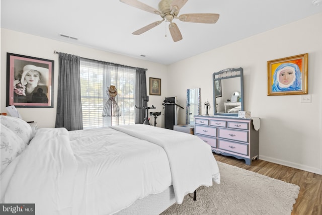 bedroom featuring wood-type flooring and ceiling fan