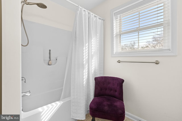 bathroom with shower / bath combo