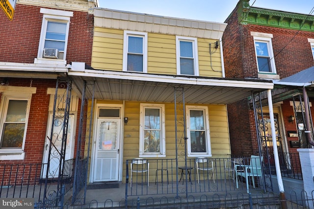 view of property featuring covered porch