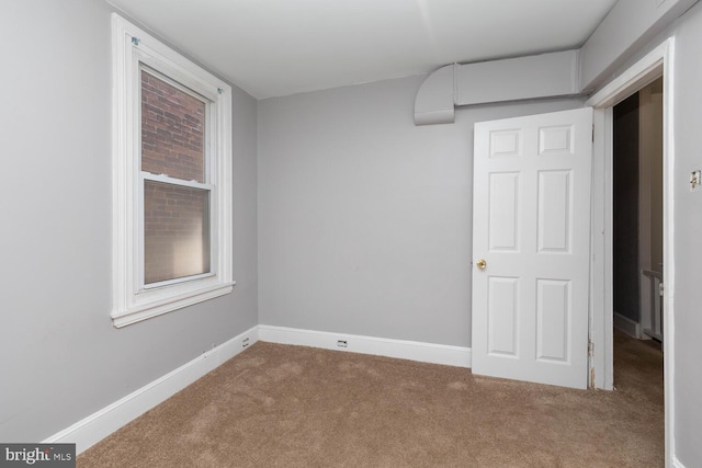 unfurnished room with carpet floors