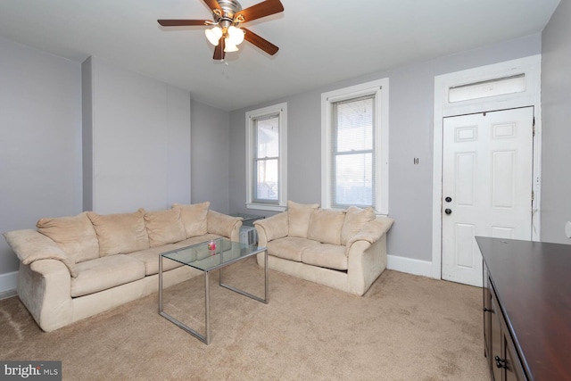 carpeted living room featuring ceiling fan