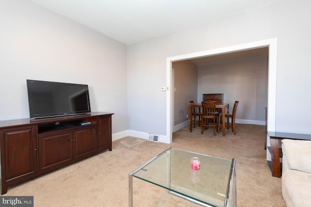 living room featuring light colored carpet