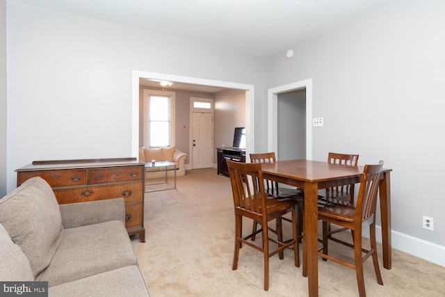 view of carpeted dining area