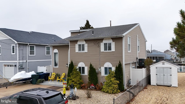 view of front of house with a storage shed