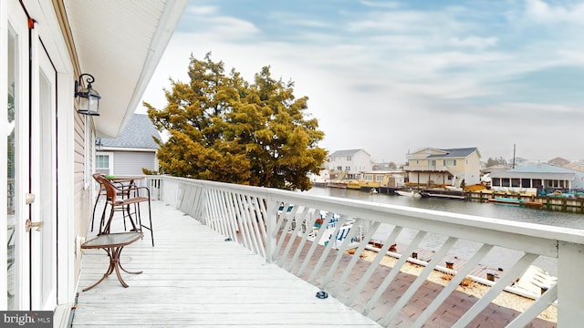 wooden deck with a water view