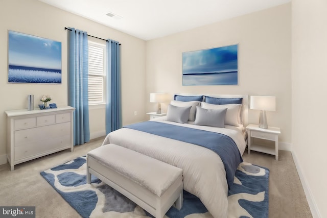 bedroom featuring light colored carpet