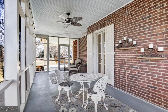 sunroom / solarium with ceiling fan