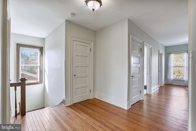 interior space featuring light wood-style floors and baseboards