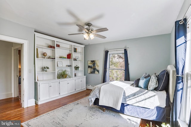 bedroom featuring wood finished floors and a ceiling fan