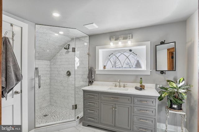 bathroom featuring recessed lighting, marble finish floor, vanity, and a shower stall