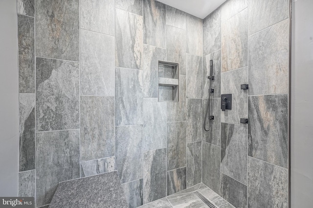 bathroom with tiled shower