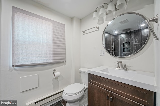 bathroom featuring vanity, a baseboard radiator, and toilet