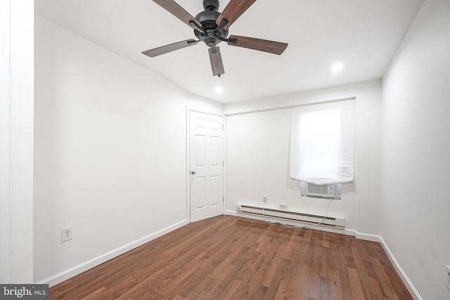 unfurnished room with ceiling fan, cooling unit, wood-type flooring, and baseboard heating