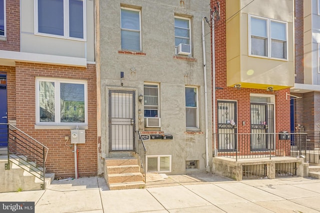 view of front of property with cooling unit