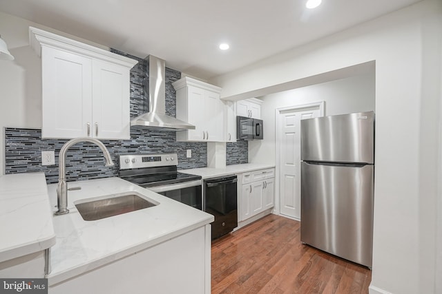 kitchen featuring light stone countertops, wall chimney range hood, black appliances, dark hardwood / wood-style floors, and white cabinetry