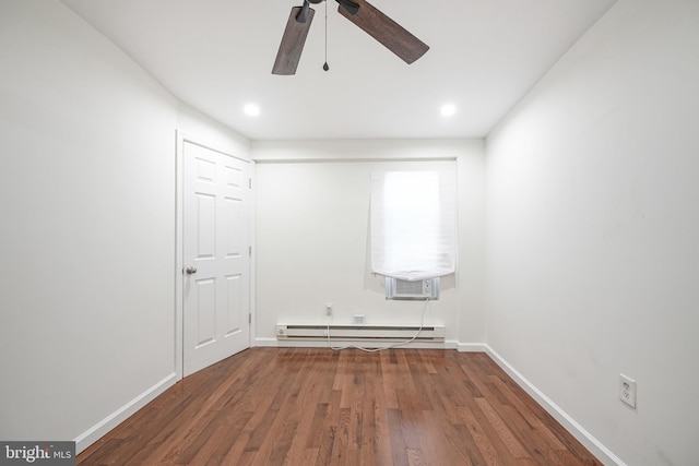 unfurnished room featuring dark hardwood / wood-style flooring, a baseboard radiator, ceiling fan, and cooling unit