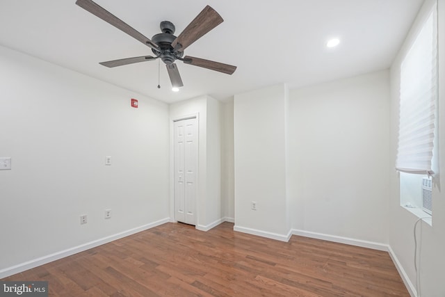 unfurnished room with hardwood / wood-style floors and ceiling fan