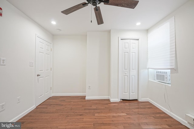 unfurnished bedroom with hardwood / wood-style flooring and ceiling fan