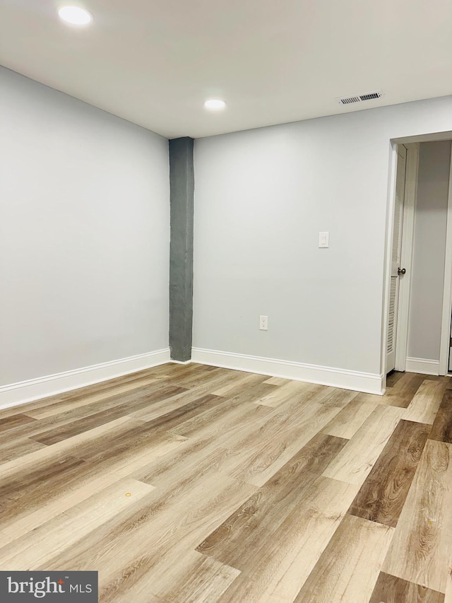 empty room with light hardwood / wood-style floors