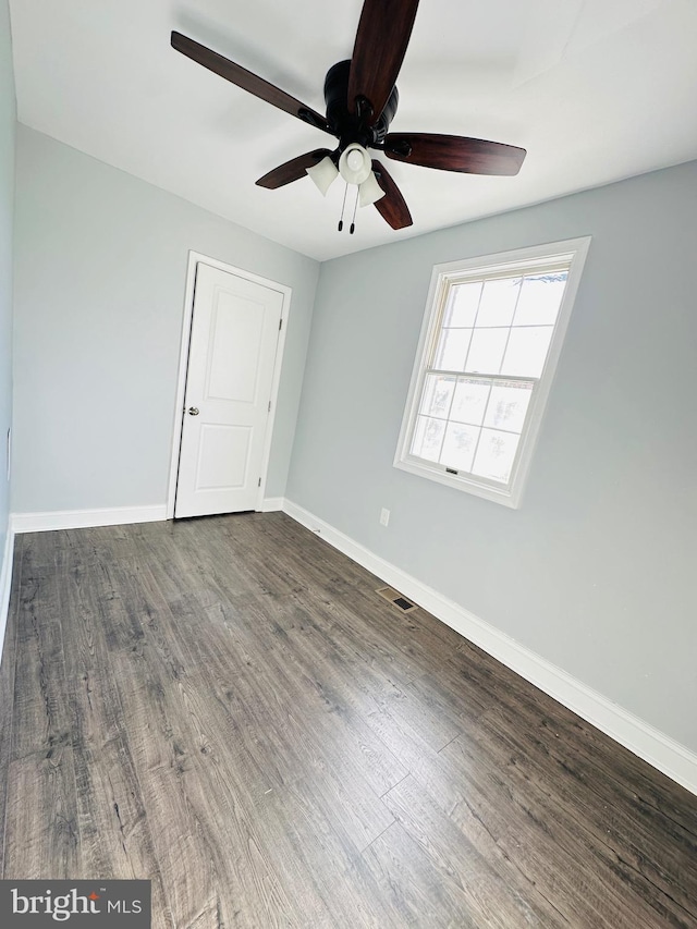 spare room featuring hardwood / wood-style flooring and ceiling fan