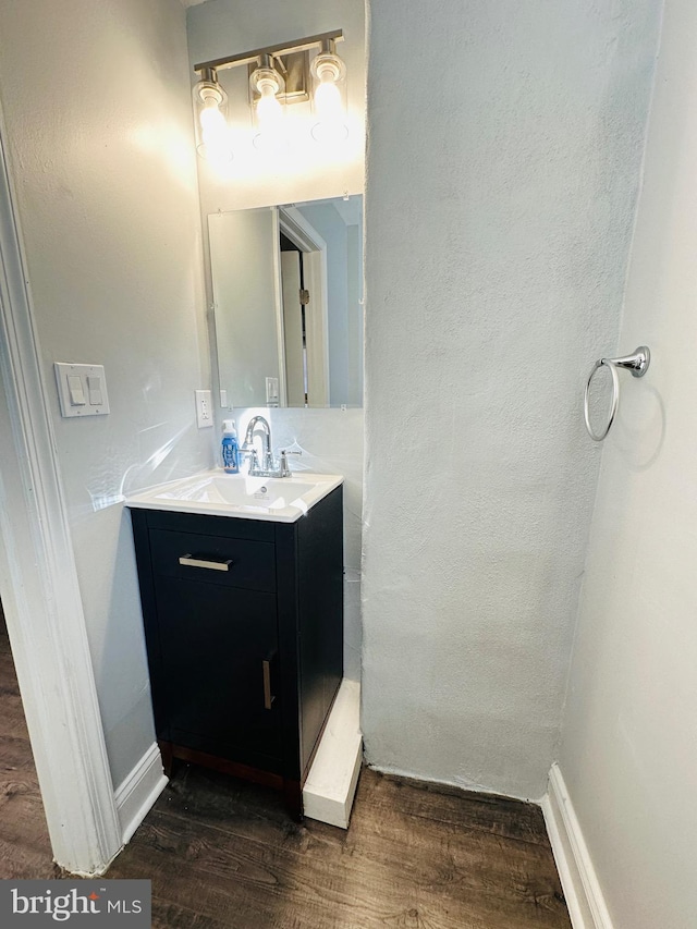 bathroom featuring vanity and wood-type flooring