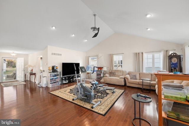 living room with ceiling fan, dark hardwood / wood-style flooring, high vaulted ceiling, and a healthy amount of sunlight