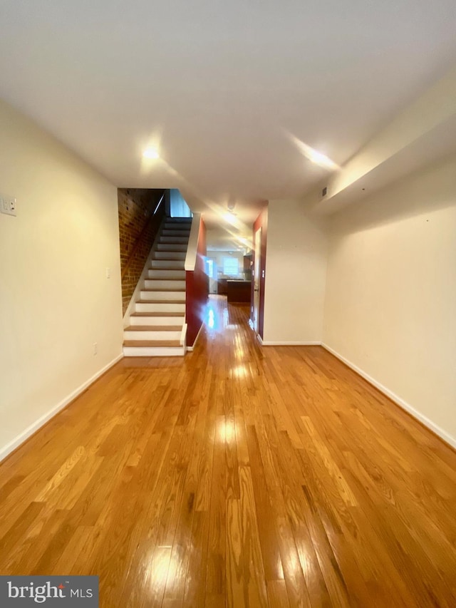 basement featuring light hardwood / wood-style floors