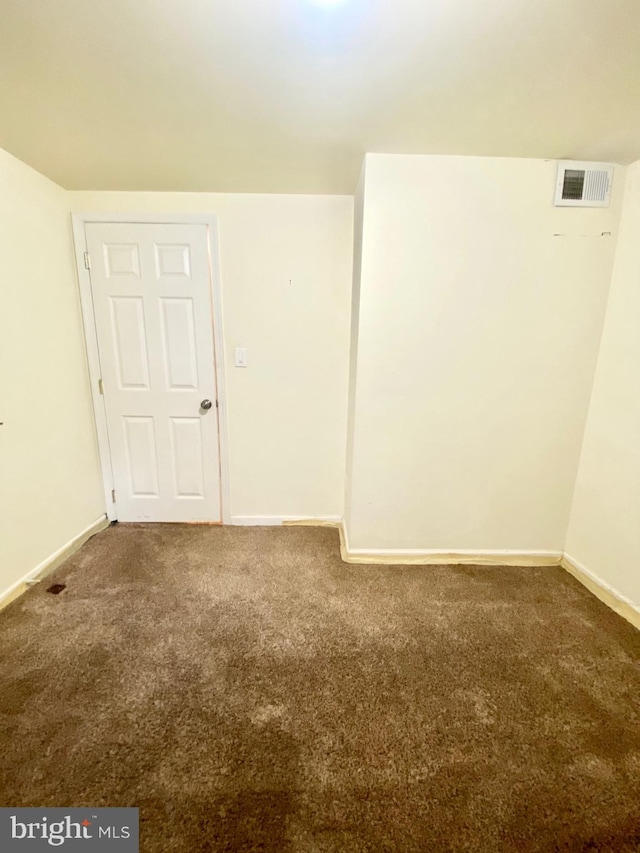 empty room featuring carpet flooring