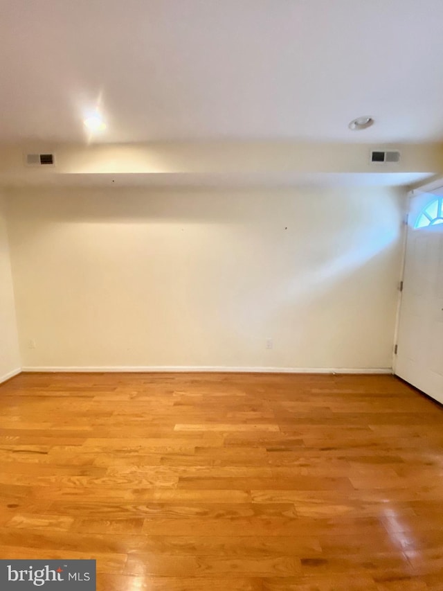 spare room featuring light wood-type flooring