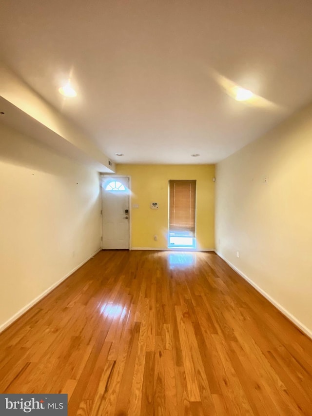 spare room with light hardwood / wood-style flooring