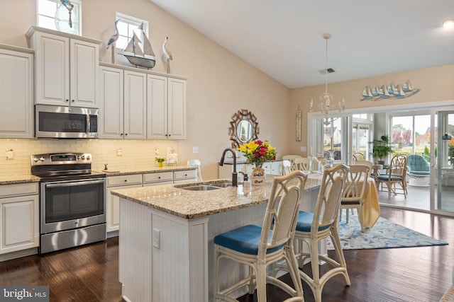 kitchen with white cabinets, stainless steel appliances, and sink