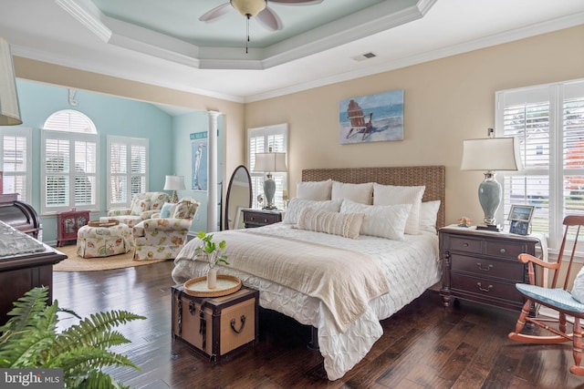 bedroom with multiple windows, ceiling fan, crown molding, and dark hardwood / wood-style floors