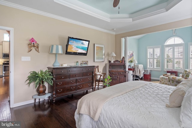 bedroom with ceiling fan, dark hardwood / wood-style flooring, ornamental molding, and decorative columns