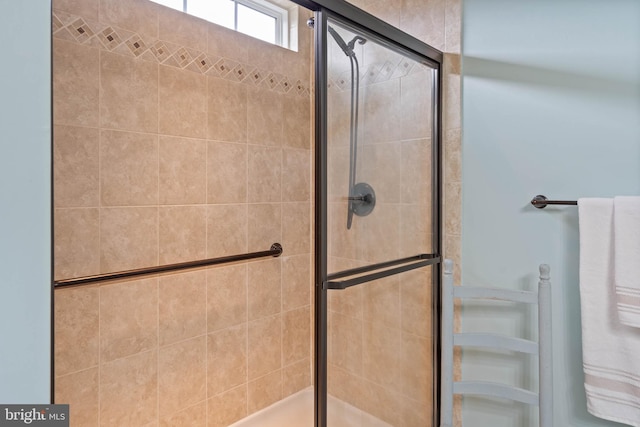 bathroom featuring an enclosed shower