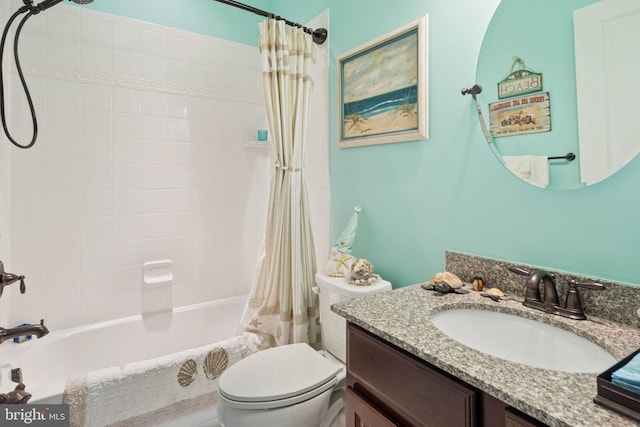 full bathroom with vanity, shower / tub combo, and toilet