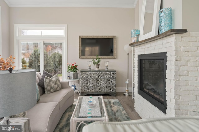 living room featuring a fireplace, beamed ceiling, crown molding, and dark wood-type flooring