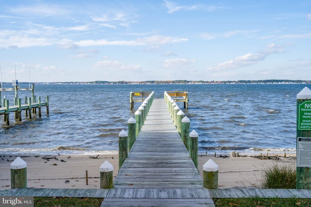 view of dock with a water view