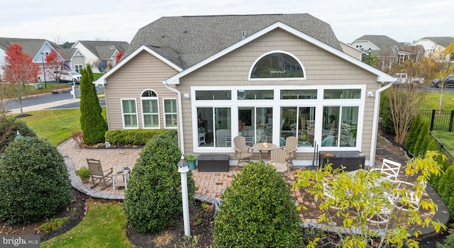 back of property featuring a sunroom