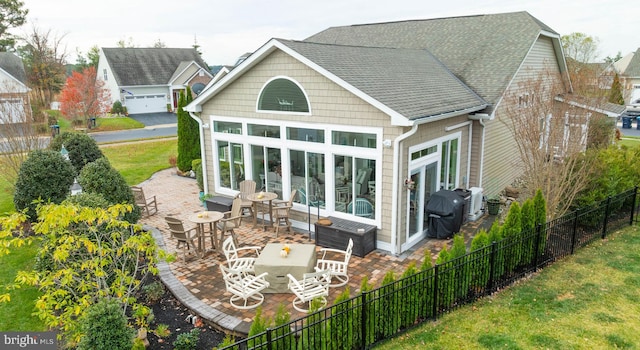 back of property featuring a patio area