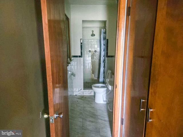 115 Mountain View Rd, Armagh, PA 15920 - hallway featuring tile walls and tile patterned flooring
