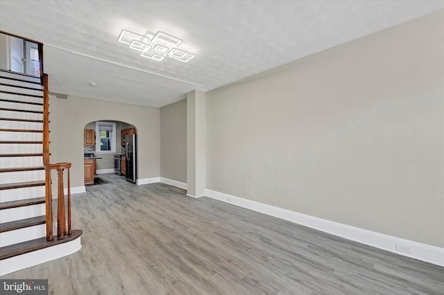 spare room featuring light hardwood / wood-style floors